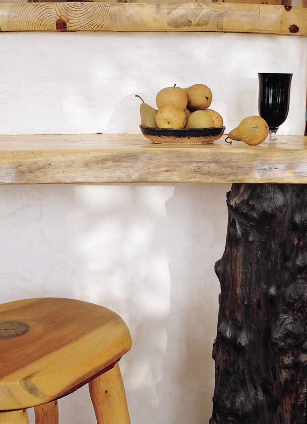 For about fifteen years Tom and Flame had been carrying around a burled piece of redwood that they'd found in Northern California, simply because they liked the shape of it. When it came time to find a support for the breakfast bar, they slid the redwood underneath, and it fit like a glove. "It required no cutting at all," Tom marvels.